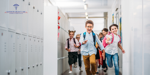 Elementary school students running through the school hallway