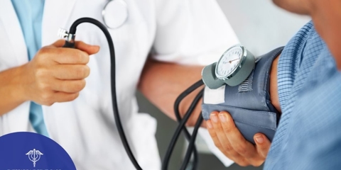 Close-up of medical professional using blood pressure cuff