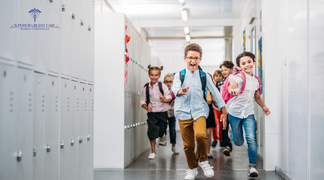 Elementary school students running through the school hallway
